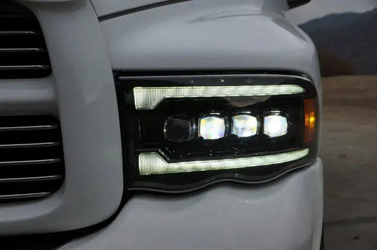 2002–2005 Dodge Ram 1500 with AlphaRex NOVA-Series projector headlights installed.