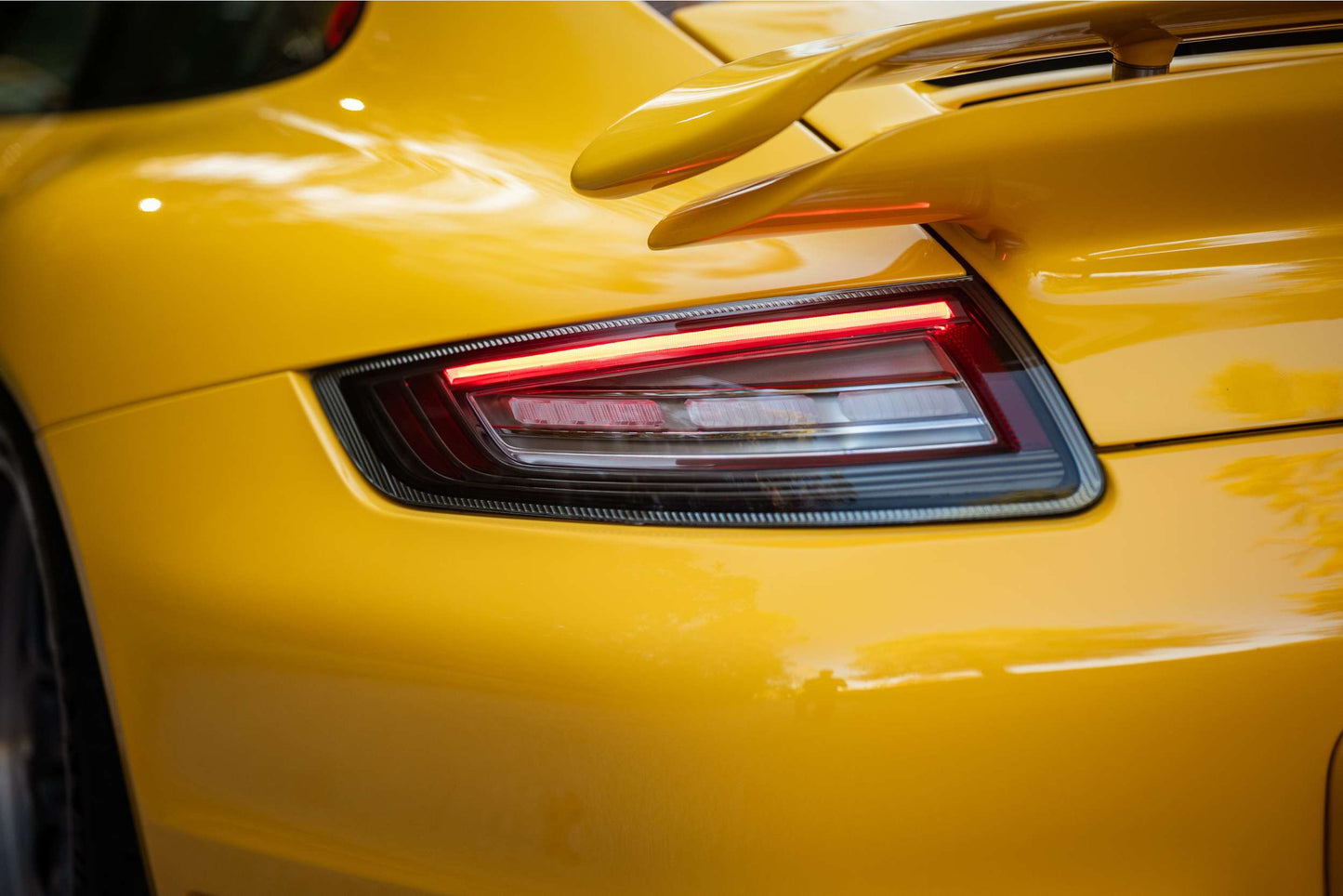 Morimoto LF745 smoked XB LED tail lights for 2005-2008 Porsche 911 997.1 rear fog light shown on car