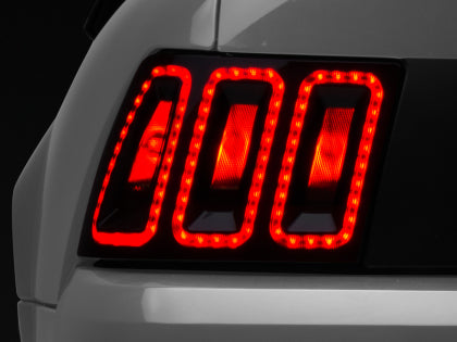 Raxiom 99-04 Ford Mustang Excluding 99-01 Cobra Icon LED Tail Lights- Black Housing (Smoked Lens) Raxiom