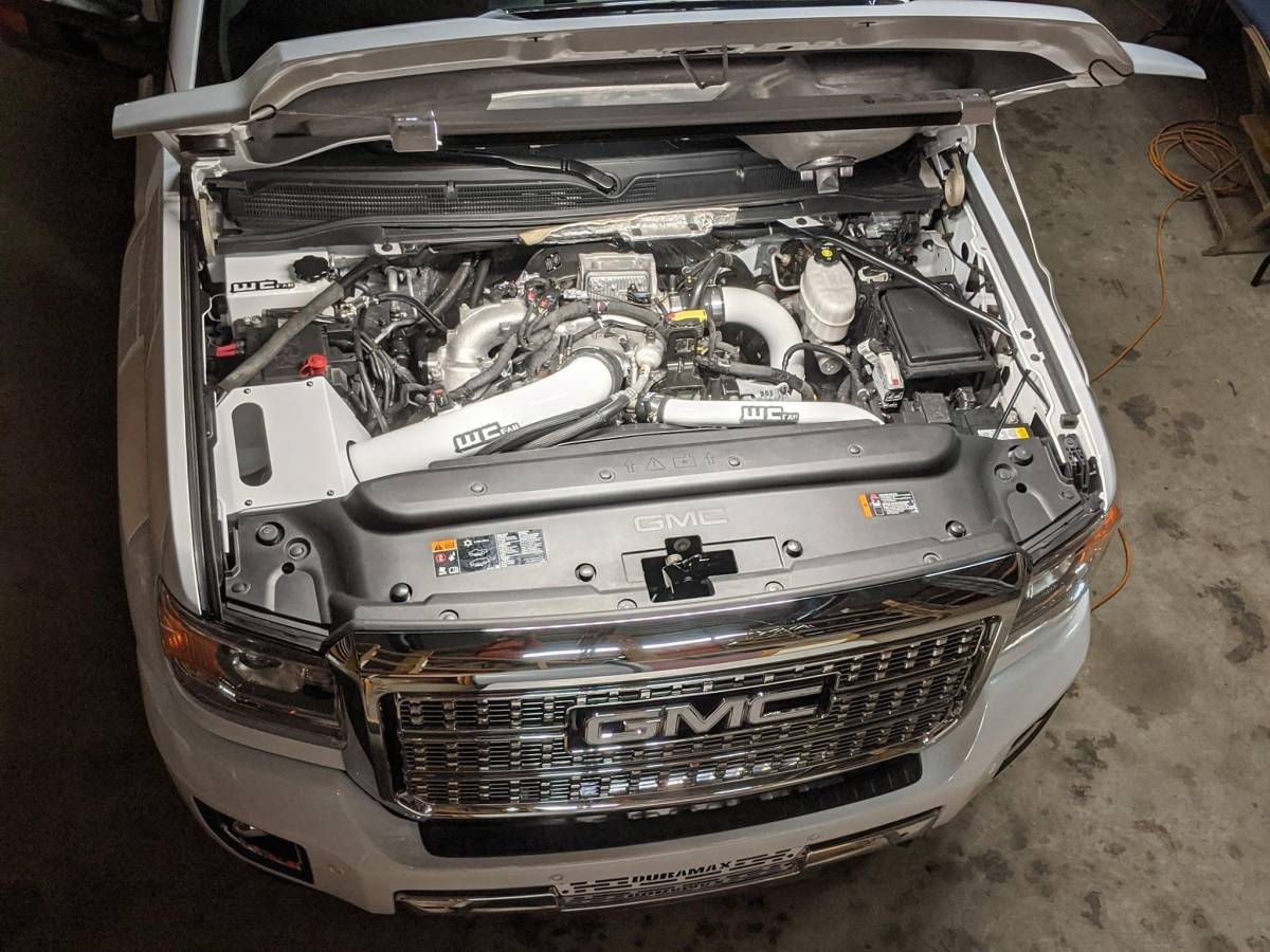 Wehrli WCF100344-RED 4 inch cold air intake kit with air box red L5P Duramax installed on truck in white