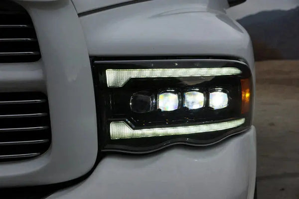 2002–2005 Dodge Ram 1500 with AlphaRex NOVA-Series projector headlights installed.