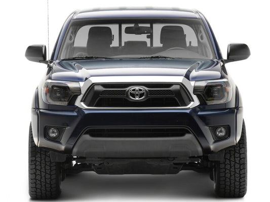 Raxiom 12-15 ToyotaTacoma Axial Series Switchback Projector Headlights- Black Housing- Clear Lens
