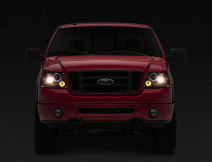 Raxiom 04-08 Ford F-150 Dual LED Halo Projector Headlights- Chrome Housing (Clear Lens)
