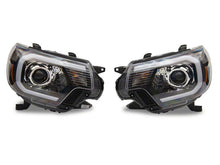 Load image into Gallery viewer, Raxiom 12-15 Toyota Tacoma Axial Projector Headlights w/ SEQL LED Bar- Blk Housing (Clear Lens)