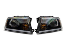 Load image into Gallery viewer, Raxiom 04-08 Ford F-150 Axial Series Projector Headlights w/ SEQL LED Bar- Blk Housing (Clear Lens)