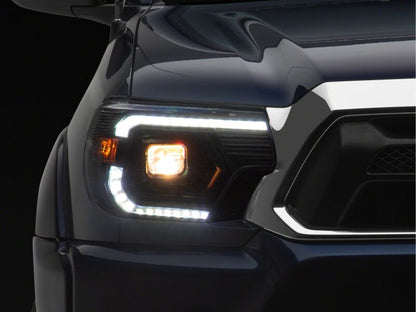 Raxiom 12-15 ToyotaTacoma Axial Series Switchback Projector Headlights- Black Housing- Clear Lens