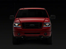 Load image into Gallery viewer, Raxiom 04-08 Ford F-150 Axial Series Projector Headlights w/ SEQL LED Bar- Blk Housing (Clear Lens)