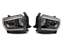 Load image into Gallery viewer, Raxiom 14-21 Toyota Tundra Axial Series Projector Headlights w/ LED Bar- Blk Housing (Clear Lens)