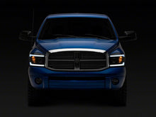 Load image into Gallery viewer, Raxiom 06-09 Dodge RAM 1500/2500/3500 Axial Headlights w/ SEQL LED Bar- Blk Housing (Clear Lens)