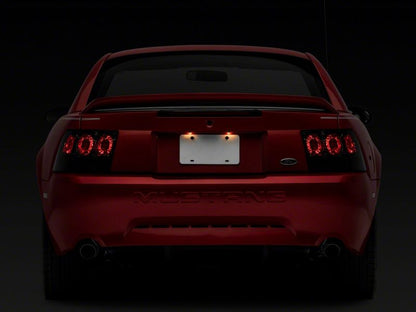 Raxiom 99-04 Ford Mustang Axial Series Altezza Style Tail Lights- Blk Housing (Smoked Lens)