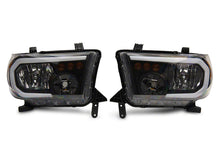 Load image into Gallery viewer, Raxiom 07-13 Toyota Tundra Axial Series Headlights w/ LED Bar- Blk Housing (Clear Lens)