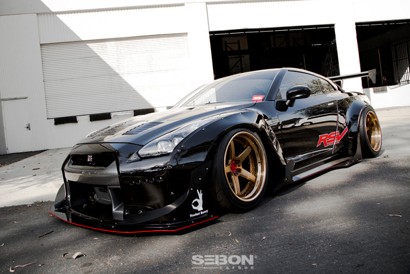 Side view of the 2009-2016 Nissan GT-R with the Seibon GT-Style Carbon Fiber Hood, highlighting its perfect OEM fitment and aggressive styling.