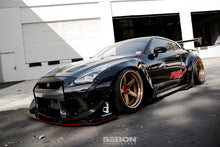 Load image into Gallery viewer, Side view of the 2009-2016 Nissan GT-R with the Seibon GT-Style Carbon Fiber Hood, highlighting its perfect OEM fitment and aggressive styling.