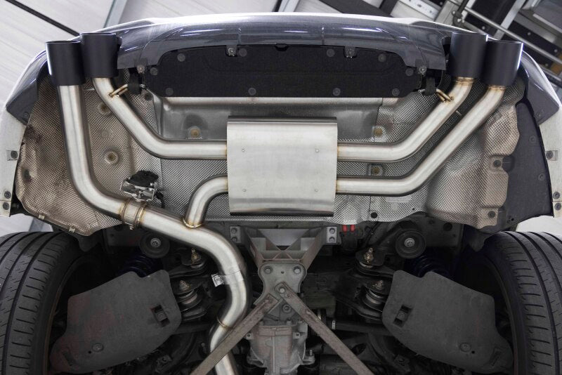 Dinan D660-0099 valved cat-back exhaust installed on BMW G01 X3 M40i and G02 X4 M40i, showing quad polished 3.75-inch tips, cold start and acceleration sound clips, factory valve operation, fitment, installed views, and Dinan 6 HP and 5 lb-ft gains.