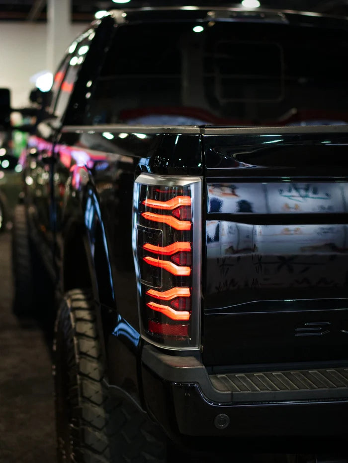 AlphaRex 659091 LUXX-Series LED tail lights for 2017-2022 Ford F-250, F-350 and F-450 without BLIS featuring black housings and smoked lenses
