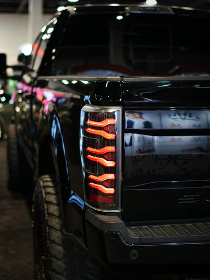 AlphaRex 659091 LUXX-Series LED tail lights for 2017-2022 Ford F-250, F-350 and F-450 without BLIS featuring black housings and smoked lenses