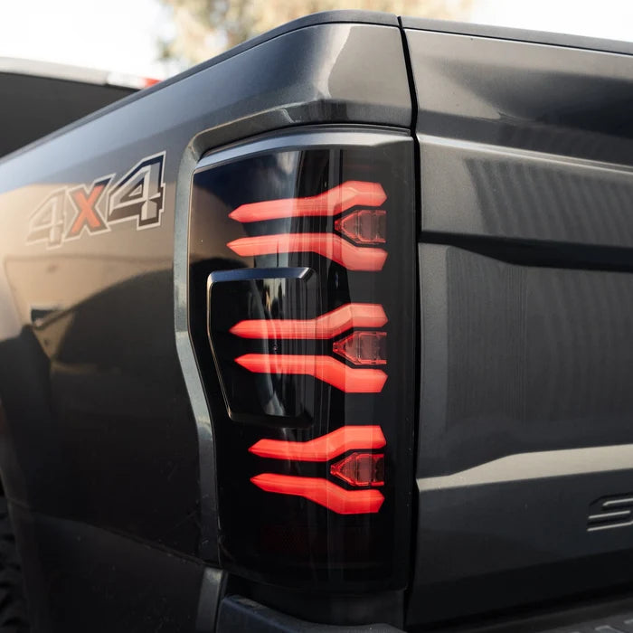 AlphaRex 659091 LUXX-Series LED tail lights for 2017-2022 Ford F-250, F-350 and F-450 without BLIS featuring black housings and smoked lenses