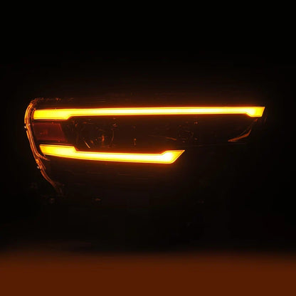 AlphaRex 880906 LUXX-Series LED projector headlights for 2025-2026 Ram 1500 with Alpha-Black housings, selectable white or amber DRLs, and sequential turn signals