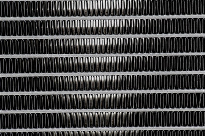 Close-up of high-density fin core and airflow grooves on PLM heat exchanger