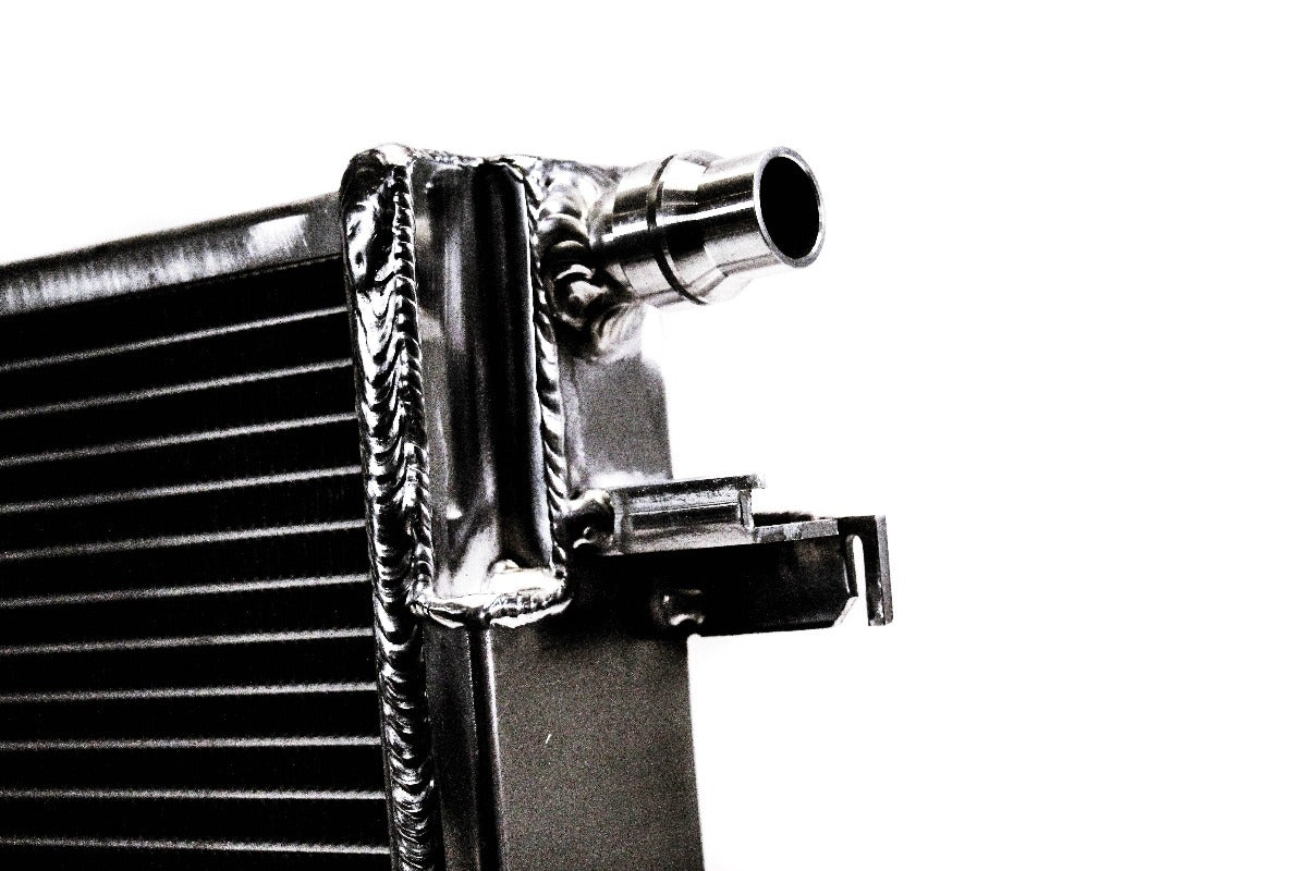 Close-up of dual-pass aluminum port on PLM heat exchanger for Supra and BMW