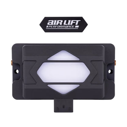 Top view of Air Lift Performance ALP4 air management manifold showing integrated illuminated center logo