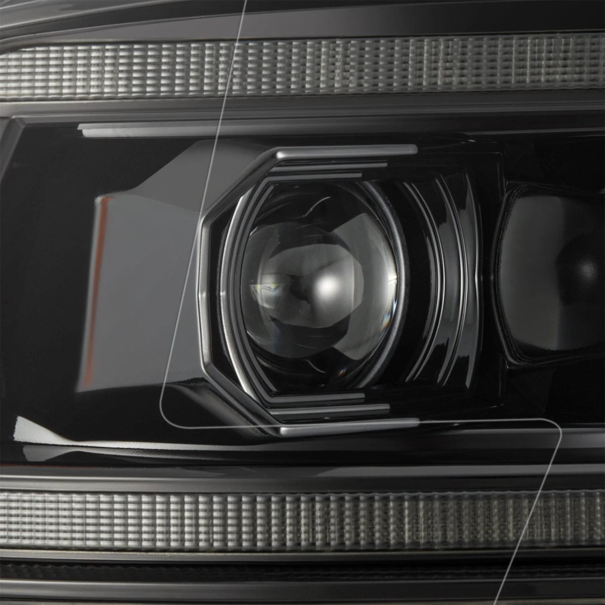 Close up view of LED projector lens and inner housing on AlphaRex 880560 Ram headlight