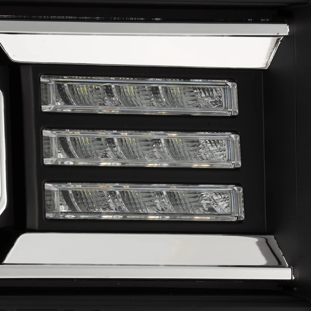 Close up view of C-plank LED light bar diffuser strip on AlphaRex 880615 GMC Sierra headlight