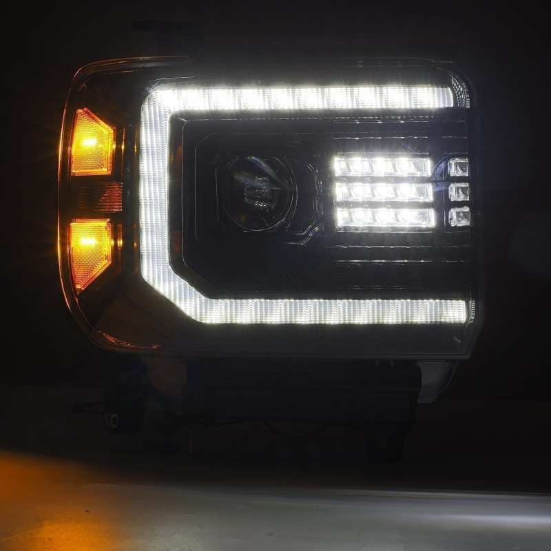 AlphaRex 880615 GMC Sierra LUXX LED headlights displaying white C-shape DRL light plank active