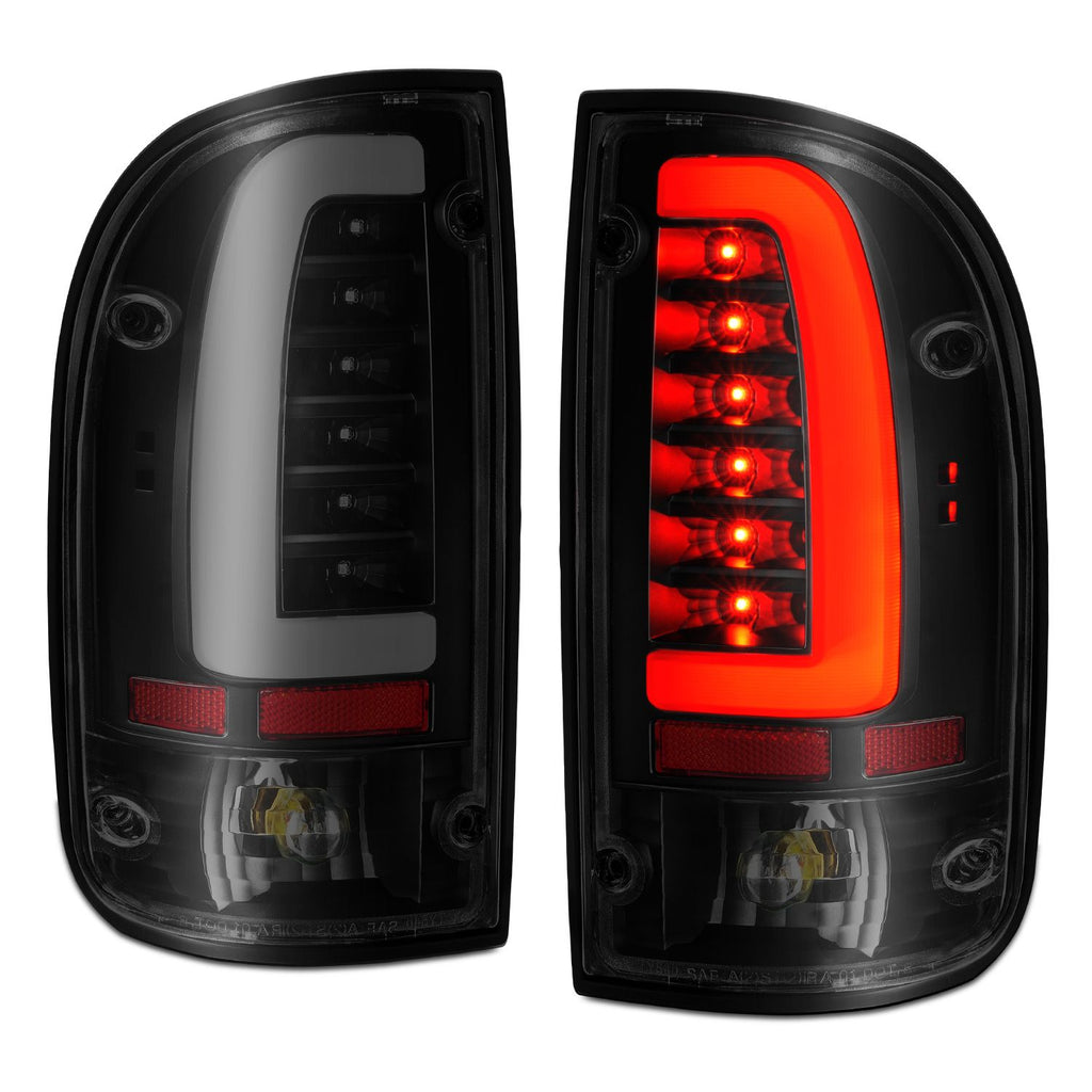 Anzo 311354 LED Tail Lights for Toyota Tacoma (95-00) with black housing, smoke lens, and bright red and white LED illumination for a bold, modern look.