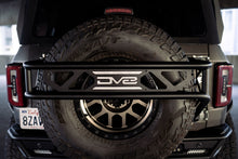 Load image into Gallery viewer, DV8 Offroad 21-23 Ford Bronco Spare Tire Guard &amp; Accessory Mount