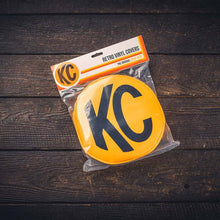 Load image into Gallery viewer, KC HiLiTES Retro 8in Round Yellow Vinyl Light Cover w/ Black KC Logo (Pair)