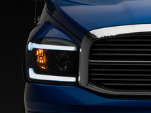 Load image into Gallery viewer, Raxiom 06-09 Dodge RAM 1500/2500/3500 Axial Headlights w/ SEQL LED Bar- Blk Housing (Clear Lens)