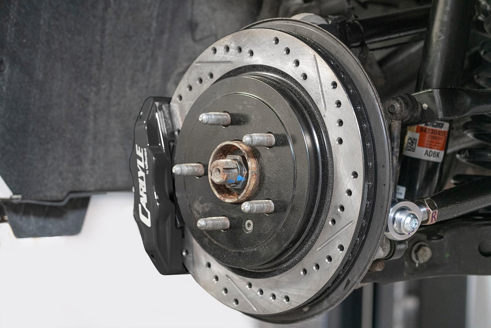 BMR DBK352 15 inch conversion brake kit with drilled slotted rotors and black calipers Camaro CTS-V G8 SS