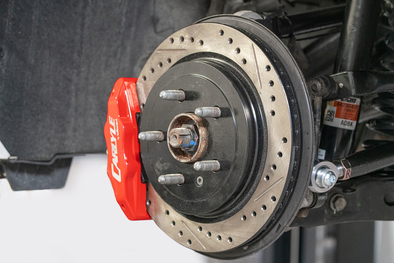 BMR DBK353 15 inch conversion brake kit with drilled slotted rotors and red calipers Camaro CTS-V G8 SS