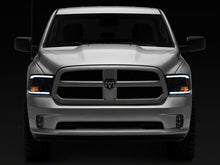 Load image into Gallery viewer, Raxiom 09-18 Dodge RAM 1500/2500/3500 Axial Headlights w/ SEQL LED Bar- Blk Housing (Clear Lens)