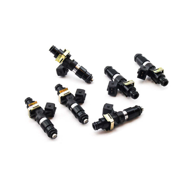 Six black fuel injectors with gold and silver accents on a white background