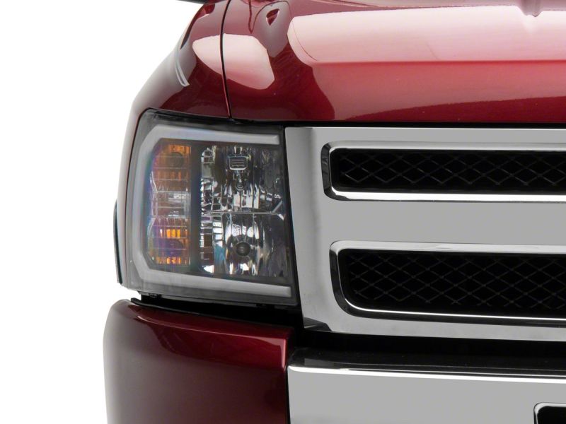 Raxiom 07-13 Chevrolet Silverado 1500 Axial Headlights w/ SEQL LED Bar- Blk Housing (Clear Lens)