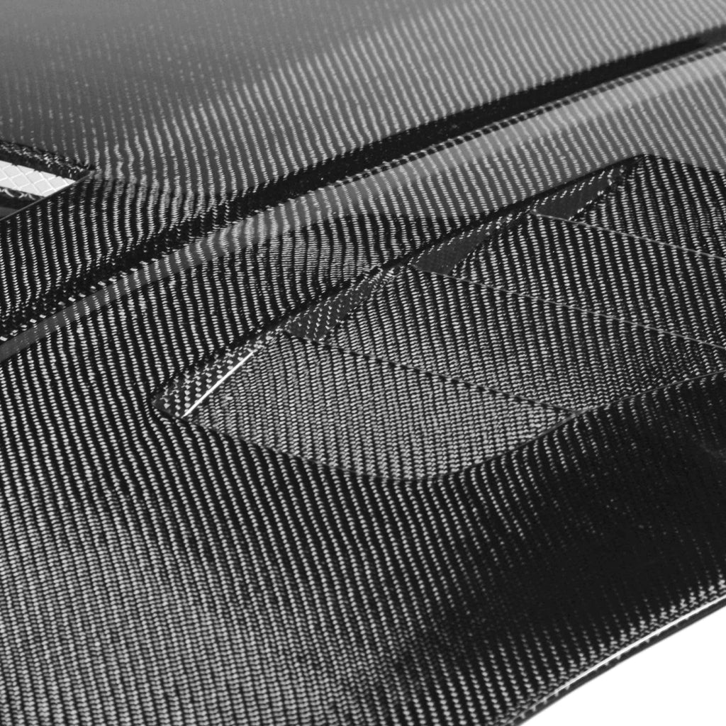 VT-Style Carbon Fiber Hood for 2007-2009 Nissan 350Z, compatible with 2003-2006 models, featuring aggressive vents and a glossy finish.