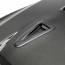 Load image into Gallery viewer, Detailed shot of the Seibon DV-Style Carbon Fiber Hood&#39;s carbon fiber texture, showcasing its lightweight construction and premium craftsmanship.