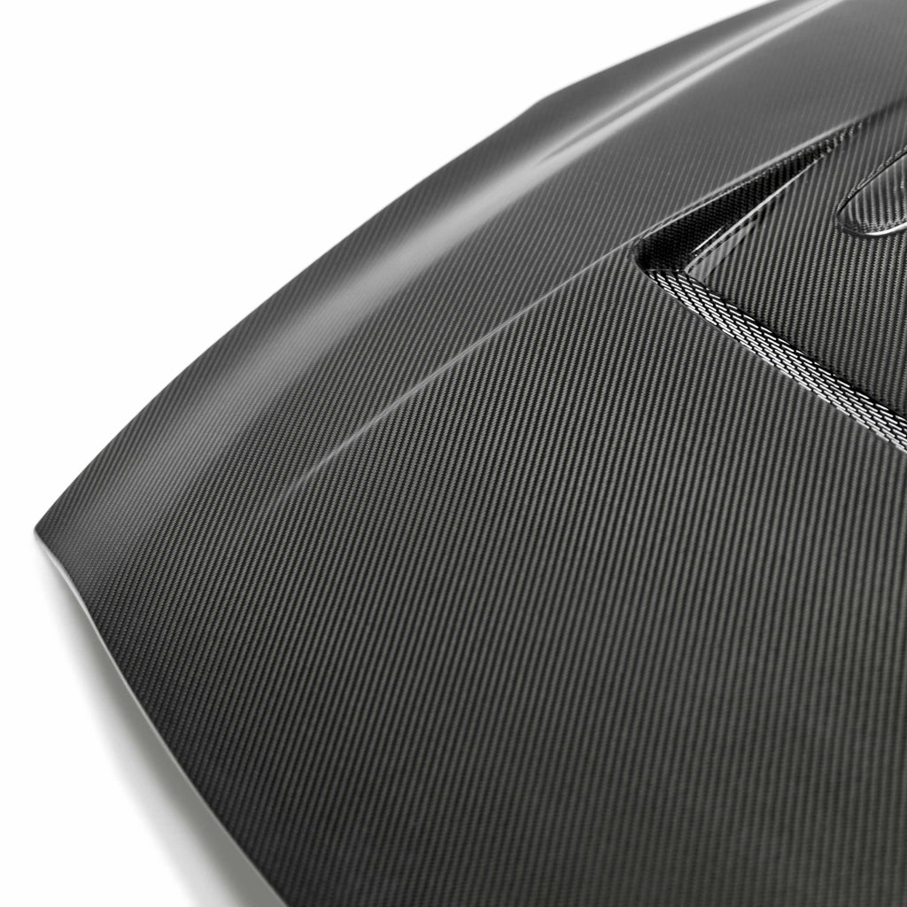 Close-up of the vented design on the Seibon HD0910NSGTR-DV DV-Style Carbon Fiber Hood, highlighting the precision carbon fiber weave and high-quality finish.