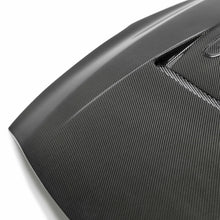 Load image into Gallery viewer, Close-up of the vented design on the Seibon HD0910NSGTR-DV DV-Style Carbon Fiber Hood, highlighting the precision carbon fiber weave and high-quality finish.