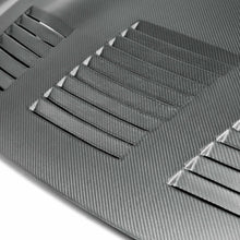 Load image into Gallery viewer, Close-up of the vented design on the Seibon GT-Style Dry Carbon Hood, highlighting its dry carbon fiber weave and premium finish.