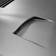 Load image into Gallery viewer, Overhead shot of the Seibon GT-Style Dry Carbon Hood on a GT-R, displaying the functional vent layout for improved cooling and airflow.