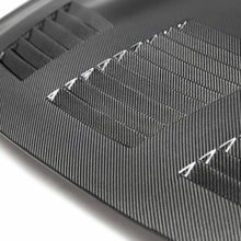 Load image into Gallery viewer, Close-up of the Seibon GT-Style Carbon Fiber Hood’s vented design, highlighting its performance-focused engineering and premium carbon fiber weave.