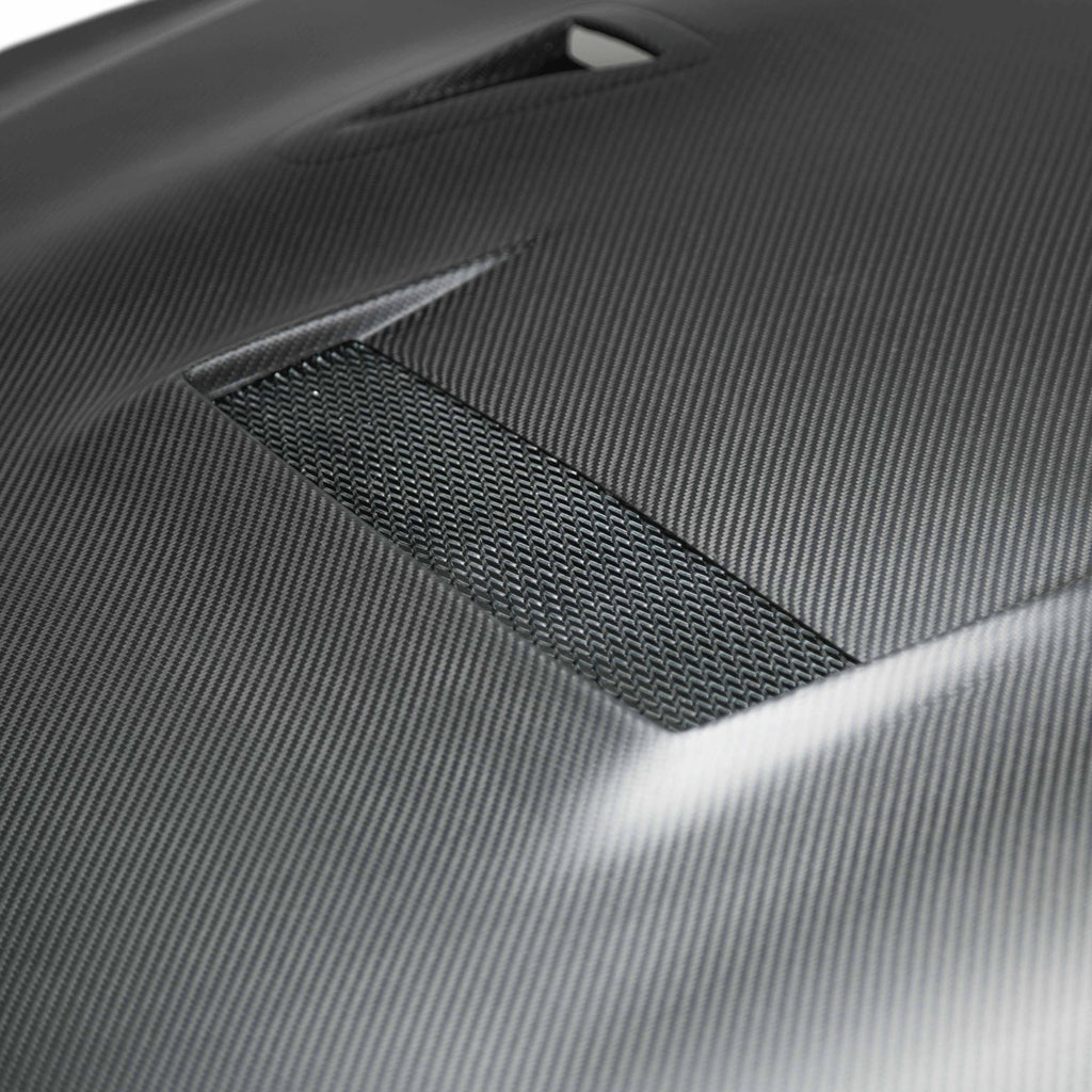 Close-up of the Seibon VSII-Style Dry Carbon Hood's vents, highlighting its dry carbon fiber texture and high-quality finish.