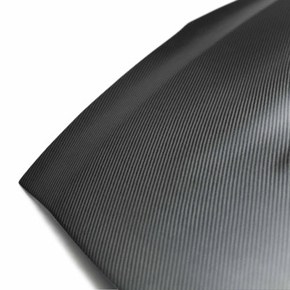 Detailed image of the dry carbon fiber weave on the Seibon VSII-Style Hood, showcasing its ultra-lightweight, performance-driven design.