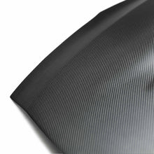 Load image into Gallery viewer, Detailed image of the dry carbon fiber weave on the Seibon VSII-Style Hood, showcasing its ultra-lightweight, performance-driven design.