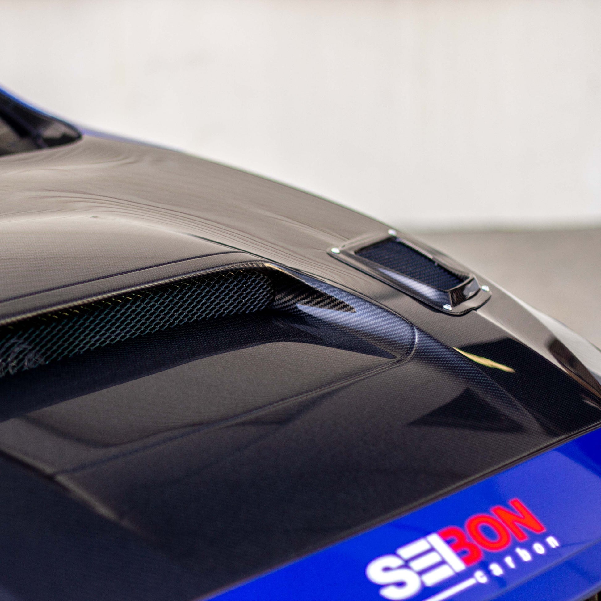 CS-Style Carbon Fiber Hood for 2015-2021 Subaru WRX/STi featuring sleek vents and a glossy finish.