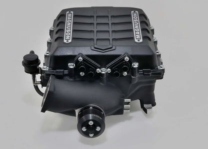 Black engine block with 'Magnuson' branding on a gray background