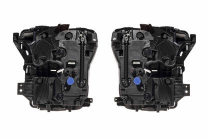 Rear view of Morimoto XB Evo LF2-502 headlights showing housings, wiring, connectors, and rear covers